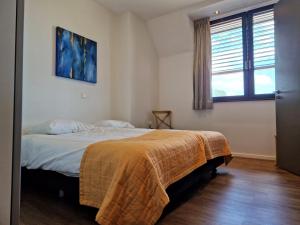 Postel nebo postele na pokoji v ubytování Het Maashotel