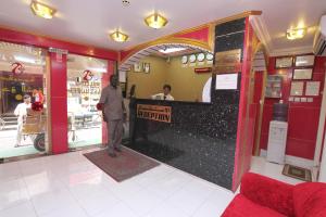 a man standing at the counter of a restaurant at Zaineast Hotel in Dubai +19 photos