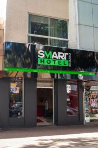 a sign for a star hotel in front of a building at SMART IGUASSU HOTEL in Foz do Iguaçu