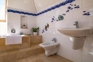 a bathroom with a sink and a toilet at Nye Creek Or Nye Creek & Little Nye in Milford on Sea +56 photos