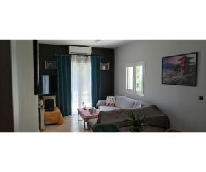TV a/nebo společenská místnost v ubytování Rafaela Apartment