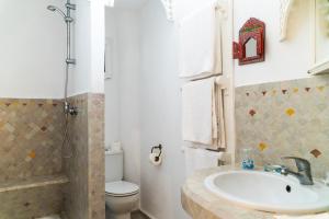 a bathroom with a sink and a toilet at Dar Liouba Hotel in Essaouira
