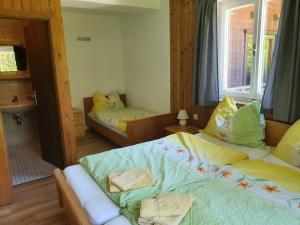 A bed or beds in a room at Landhaus Alexa