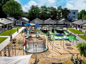 a park with a playground with slides and rides at CAMP NORD RESORT in Mielno