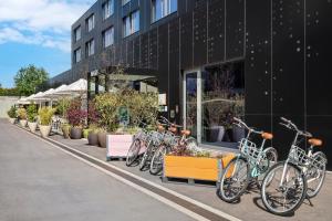 a row of bikes parked outside of a building at INNSiDE by Meliá Luxembourg in Luxembourg