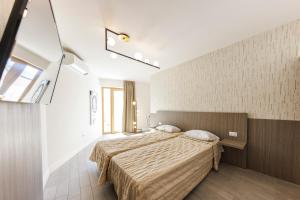 Posteľ alebo postele v izbe v ubytovaní Exclusive Suites Riva