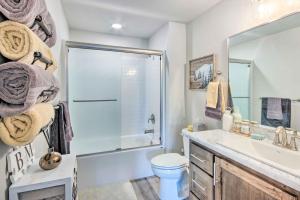 a bathroom with a shower and a sink and a toilet at Red Lodge Home with Patio about 1 Mi from Downtown! in Red Lodge