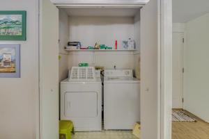 a laundry room with a washer and dryer in it at Syringa House in McCall