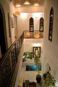 a staircase with a swimming pool in a building at Riad Beata Bed & Breakfast in Marrakesh