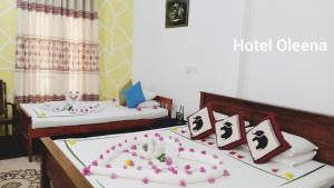 Postel nebo postele na pokoji v ubytování Oleena Home Stay