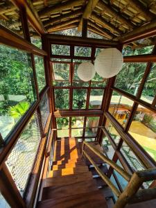 a view from the top of a building with windows at Ycatu Beach House in São Sebastião