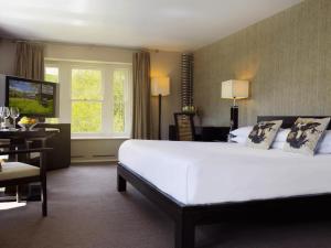 Voodi või voodid majutusasutuse BrookLodge & Macreddin Village toas
