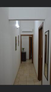 a hallway with a hallway leading to a room at Casa Vacanze Da Laura in San Vito lo Capo