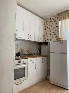 Una cocina o cocineta en Cosy Home