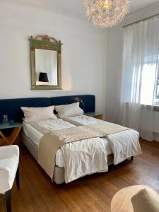 Postel nebo postele na pokoji v ubytování Kläve12 Guesthouse