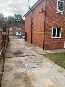 a patio outside of a brick building at The Glebe DN22 in Retford