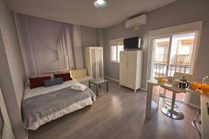 Posteľ alebo postele v izbe v ubytovaní Apartamentos Infantes 28
