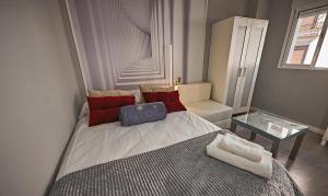 Posteľ alebo postele v izbe v ubytovaní Apartamentos Infantes 28
