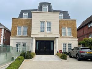 a house with a car parked in front of it at luxurious, 2 bed, 2 bath penthouse apartment in highly desirable Chigwell in Chigwell
