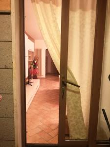 an open door to a hallway with a staircase at Casa Mica in Abbadia San Salvatore