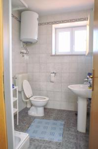 a bathroom with a toilet and a sink at Apartments by the sea Kneza, Korcula - 167 in Račišće