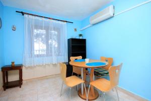 a dining room with a table and chairs at Apartments by the sea Brna, Korcula - 171 in Smokvica