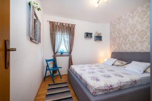Postel nebo postele na pokoji v ubytování Apartments with a parking space Povljana, Pag - 232