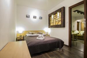 Posteľ alebo postele v izbe v ubytovaní Dolina Resort Zakopane