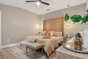 a bedroom with a bed and a couch at Centrally located villa, family reunion, amazing outdoor space, pet friendly in Orlando