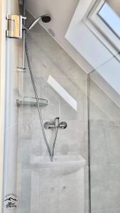a bathroom with a shower and a sink at Apartament Nad Zaporą in Szlembark +20 photos