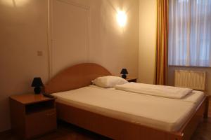 Postel nebo postele na pokoji v ubytování Suite Hotel 200m zum Prater