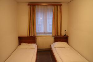 Postel nebo postele na pokoji v ubytování Suite Hotel 200m zum Prater