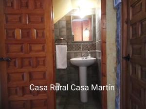 a bathroom with a sink and a mirror at Casa Rural Casa Martin in Cueva de Ágreda