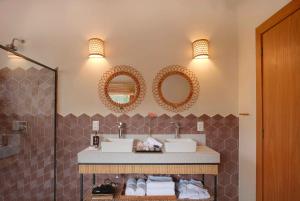 Um banheiro em Embaúba Boutique Hotel