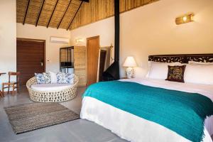 Cama ou camas em um quarto em Embaúba Boutique Hotel
