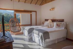 Cama ou camas em um quarto em Embaúba Boutique Hotel