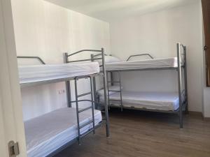 Posteľ alebo postele v izbe v ubytovaní Albergue y Gelateria il nonno