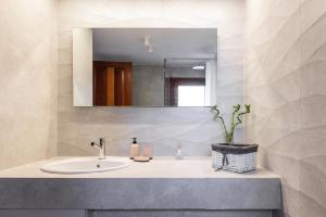 a bathroom with a sink and a mirror at Luna Villa Private Beach in Nea Irakleia +48 photos