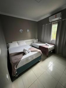 Ein Bett oder Betten in einem Zimmer der Unterkunft Pousada Praia Bela