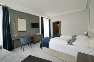 Llit o llits en una habitació de Hotel Zlatá Hvězda