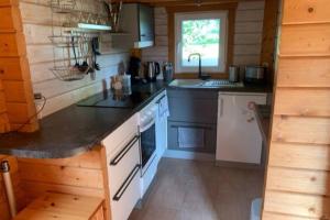 Kuchyň nebo kuchyňský kout v ubytování Bezauberndes Ferienhaus mitten in der Natur.