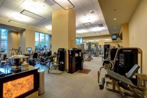 a gym with treadmills and machines in a room at StripViewSuites Penthouse Two-Bedroom Conjoined Suite in Las Vegas