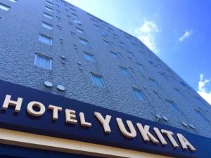 a hotel sign on the side of a building at Hotel Yukita - Vacation STAY 20929v in Sapporo