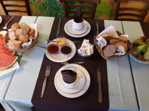 a table with plates and bowls of food on it at Hotel Jardín Concha in Valle Gran Rey