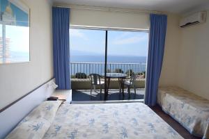 Postel nebo postele na pokoji v ubytování Sun Beach