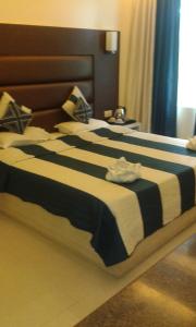 Postel nebo postele na pokoji v ubytování Hotel Shompen