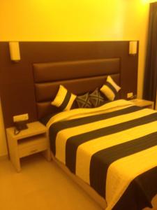 Postel nebo postele na pokoji v ubytování Hotel Shompen