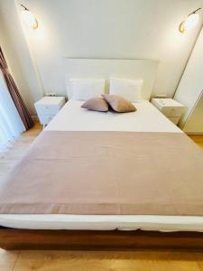 Postel nebo postele na pokoji v ubytování Eine wunderschöne Wohnung mit Pool und Garten