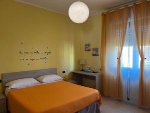 A bed or beds in a room at Color House Malpensa B&B