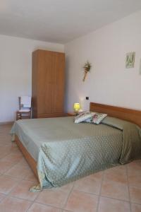 Postel nebo postele na pokoji v ubytování Agriturismo Sant'Anna + 27 fotografií